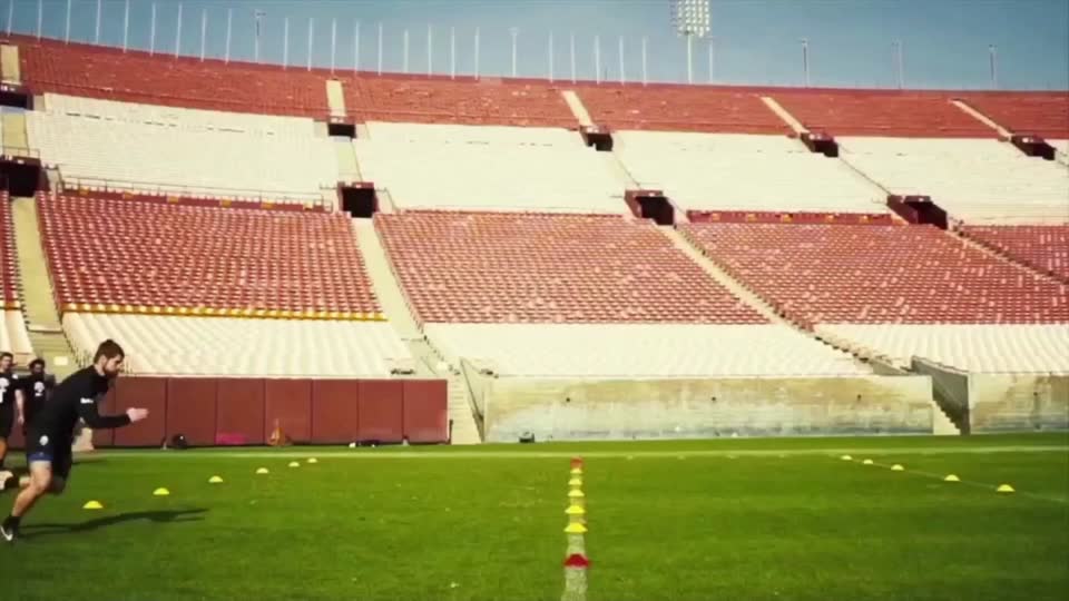 Athlete running drills in an empty historic stadium